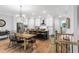 Open-concept kitchen with island, stainless steel appliances, and hardwood floors at 201 Retreat Ln, Canton, GA 30114