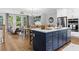 Bright, modern kitchen with island, stainless appliances, and open floor plan at 201 Retreat Ln, Canton, GA 30114