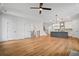 Open-concept living room flows into the kitchen, featuring hardwood floors and natural light at 201 Retreat Ln, Canton, GA 30114