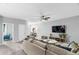 Bright living room with comfortable seating, a ceiling fan, and a mounted television at 201 Retreat Ln, Canton, GA 30114