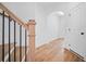Staircase with wood treads, black railings, and white risers leading to the upper level at 201 Retreat Ln, Canton, GA 30114