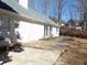 Sprawling backyard with a custom flagstone patio, well-maintained lawn and mature trees at 735 Sunset Ridge Ln, Lawrenceville, GA 30045