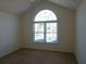 Bright bedroom features a large window and neutral carpet, creating a calming and inviting space at 735 Sunset Ridge Ln, Lawrenceville, GA 30045