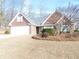 Charming one-story brick home with manicured lawn and attached two-car garage at 735 Sunset Ridge Ln, Lawrenceville, GA 30045
