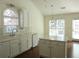 Eat-in kitchen with stainless steel appliances, island, and plenty of natural light at 735 Sunset Ridge Ln, Lawrenceville, GA 30045
