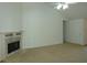 Comfortable living room with a stylish fireplace, plush carpet, and ample natural light at 735 Sunset Ridge Ln, Lawrenceville, GA 30045