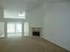 Bright living room featuring a fireplace, plush carpet, and an open floor plan at 735 Sunset Ridge Ln, Lawrenceville, GA 30045