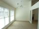 Bright living room featuring large windows, neutral carpet, and a fireplace at 735 Sunset Ridge Ln, Lawrenceville, GA 30045