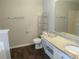 Full bathroom with wood-look floor, granite vanity top and tub/shower at 4423 Gladewood Run, Union City, GA 30291