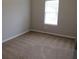 Cozy bedroom featuring plush carpeting and natural light at 4423 Gladewood Run, Union City, GA 30291