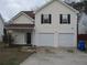 Inviting two-story home with attached garage and a well-maintained lawn, located in a desirable neighborhood at 4423 Gladewood Run, Union City, GA 30291