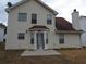 Home featuring an outdoor patio area and chimney at 4423 Gladewood Run, Union City, GA 30291