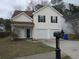Charming two-story home with a two-car garage and neutral siding, perfect for a growing Gathering at 4423 Gladewood Run, Union City, GA 30291