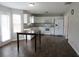 Modern kitchen with white cabinets, stainless steel appliances, and hardwood floors, perfect for Gathering gatherings at 4423 Gladewood Run, Union City, GA 30291