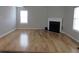 Spacious living room featuring a fireplace, hardwood floors, and natural light from multiple windows at 4423 Gladewood Run, Union City, GA 30291