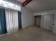 Bedroom featuring large windows, carpet floors, a vaulted ceiling, and closet at 5820 Par Four Ct, Lithonia, GA 30038