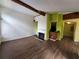 Spacious living room features wood floors, a fireplace, wooden beam and open access to the kitchen at 5820 Par Four Ct, Lithonia, GA 30038