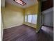 Bright living room with laminate floors and large windows at 5820 Par Four Ct, Lithonia, GA 30038