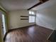 Living Room features wood floors, a fireplace, a large window and access to a covered deck at 5820 Par Four Ct, Lithonia, GA 30038