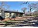 A spacious backyard featuring green grass, utility access, and great lighting at 127 Holly St, Social Circle, GA 30025