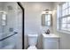 Contemporary bathroom with glass-enclosed shower, modern vanity, and updated fixtures at 127 Holly St, Social Circle, GA 30025