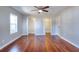 Large primary bedroom boasts hardwood floors and spacious closets for ample storage at 127 Holly St, Social Circle, GA 30025