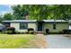 Charming single-story home featuring a well-manicured front yard and inviting entrance at 127 Holly St, Social Circle, GA 30025