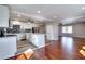 Open concept kitchen boasts an island, modern appliances, and stylish flooring at 127 Holly St, Social Circle, GA 30025