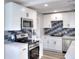 Updated kitchen with stainless steel appliances and a sleek, modern design at 127 Holly St, Social Circle, GA 30025