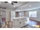Updated kitchen island with seating and storage, seamlessly connecting to a cozy dining area at 127 Holly St, Social Circle, GA 30025