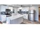 Modern kitchen with white cabinetry, stainless steel appliances, and a stylish island at 127 Holly St, Social Circle, GA 30025