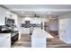 Modern kitchen with white cabinets, stainless steel appliances, and a convenient island at 127 Holly St, Social Circle, GA 30025