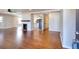 Open living space with fireplace, hardwood floors, and seamless flow to the updated kitchen at 127 Holly St, Social Circle, GA 30025