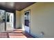 The cozy screened-in porch features brick floors and ample natural light at 127 Holly St, Social Circle, GA 30025