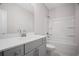 Bathroom featuring a tub/shower combo, vanity, sink and tile floors at 203 Retreat Ln, Canton, GA 30114