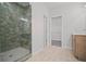 Bathroom with tiled shower, glass door, neutral tile floor, and cabinet sink at 203 Retreat Ln, Canton, GA 30114