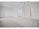 Open bedroom featuring large closets and bathroom entrance with plush carpet at 203 Retreat Ln, Canton, GA 30114