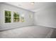 Bright bedroom with large windows, gray carpet, and neutral paint at 203 Retreat Ln, Canton, GA 30114