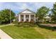 Beautiful clubhouse featuring stately columns and manicured landscaping for an elegant, welcoming atmosphere at 203 Retreat Ln, Canton, GA 30114