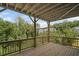 Large wooden deck offering beautiful views of the surrounding trees and neighborhood at 203 Retreat Ln, Canton, GA 30114