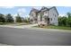 A charming new two story townhome in a well-manicured community, on a sunny day at 203 Retreat Ln, Canton, GA 30114