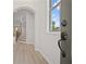 Welcoming foyer with hardwood floors and stairway with rod iron spindles at 203 Retreat Ln, Canton, GA 30114
