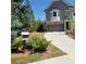 Well-maintained front yard features lush greenery and a smooth, clean driveway at 203 Retreat Ln, Canton, GA 30114