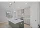 Modern kitchen with stainless steel appliances, a large island, and stylish pendant lighting at 203 Retreat Ln, Canton, GA 30114