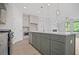 Open-concept kitchen with island, quartz countertop, and stainless steel appliances at 203 Retreat Ln, Canton, GA 30114