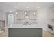 Open-concept kitchen with stainless steel appliances, a large island, and stylish cabinetry at 203 Retreat Ln, Canton, GA 30114