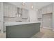 Spacious kitchen with stainless steel appliances, an island, modern range hood and herringbone backsplash at 203 Retreat Ln, Canton, GA 30114