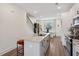 Bright kitchen with granite counters, stainless steel appliances, and a view of the adjacent dining area at 310 Mcdonough Se Blvd # 104, Atlanta, GA 30315