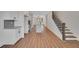 Spacious living room and kitchen open concept with light wood floors and a modern island at 310 Mcdonough Se Blvd # 104, Atlanta, GA 30315