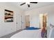 This main bedroom has 2 closets, ensuite bathroom access, a ceiling fan, and modern decor at 310 Mcdonough Se Blvd # 104, Atlanta, GA 30315